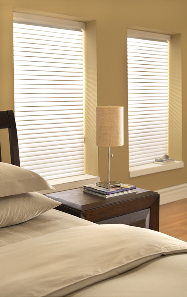 Bedroom with white shades